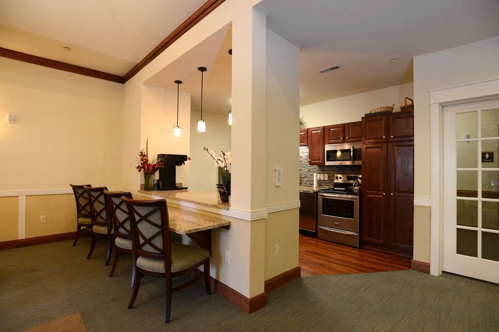 Community Room Kitchen and Breakfast Bar at Highlands at Riverwalk Apartments 55+, Mequon, WI,53092